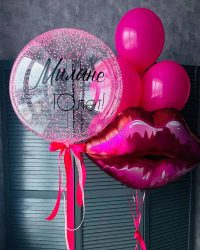 Pink lips balloon with a heart shaped balloon and a balloon with a heart on it.